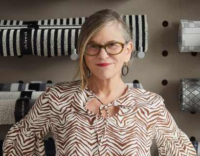 portrait of Sandy Chilewich in front of fabric samples